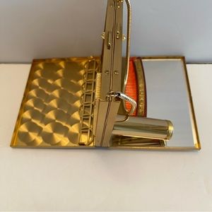 Vintage dance purse, powder, lipstick, comb, cigarette holder. Gold tone